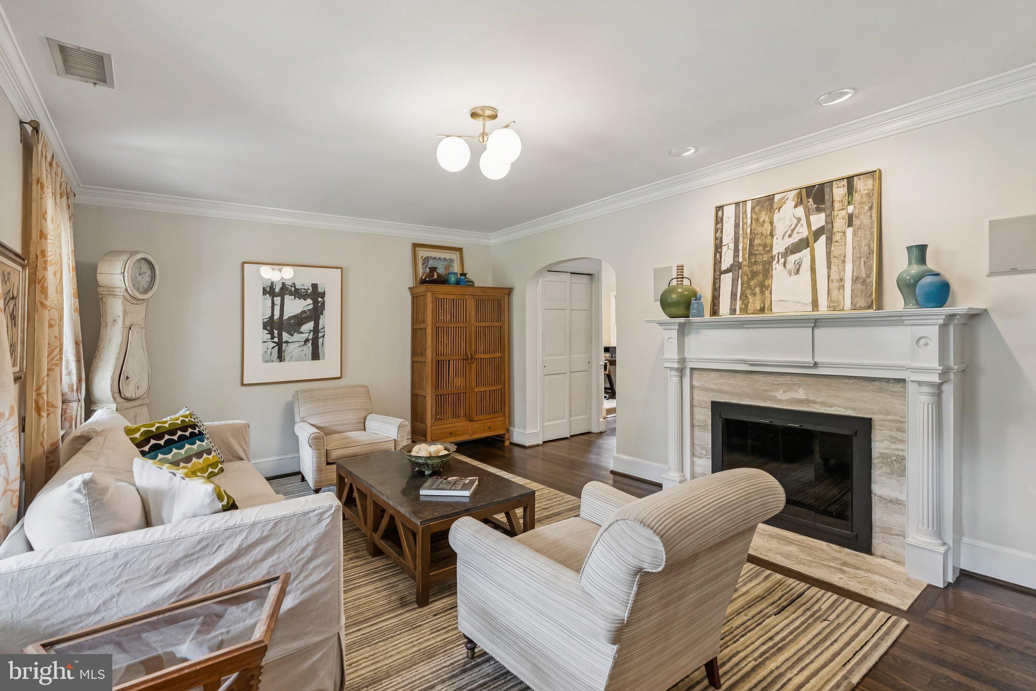 8109 Custer Road Bethesda, MD 20814 - Photo 5 of 54 a living room with furniture and a fireplace