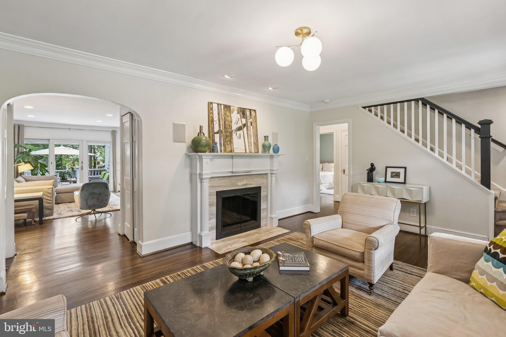 8109 Custer Road Bethesda, MD 20814 - Photo 7 of 54 a living room with furniture and a fireplace