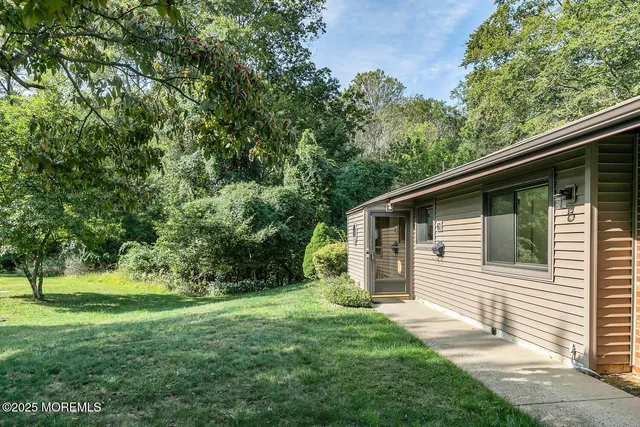 a backyard of a house with lots of green space