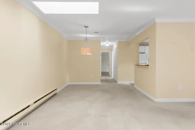 an empty room with a empty space and windows