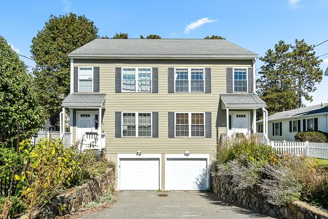 front view of a house with a yard