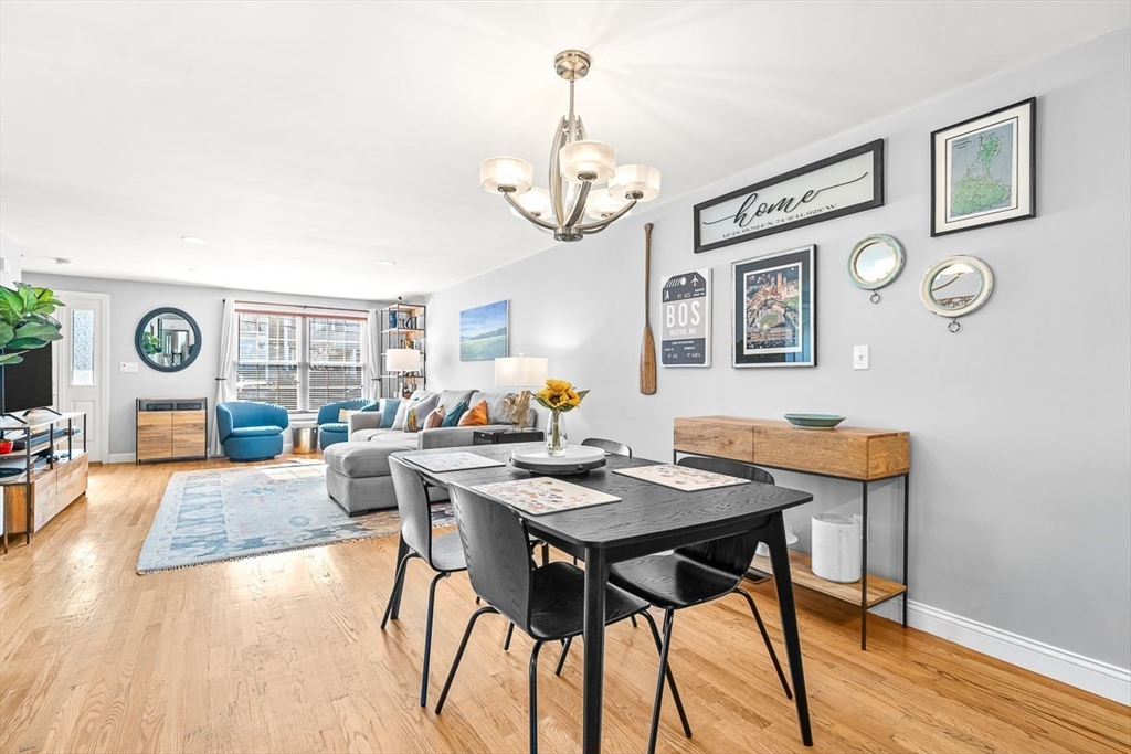 77 Warren Street, Unit A Arlington, MA 02474 - Photo 12 of 34 a view of a dining room with furniture window and wooden floor