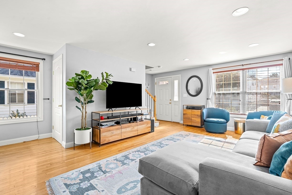 77 Warren Street, Unit A Arlington, MA 02474 - Photo 14 of 34 a living room with furniture and a flat screen tv
