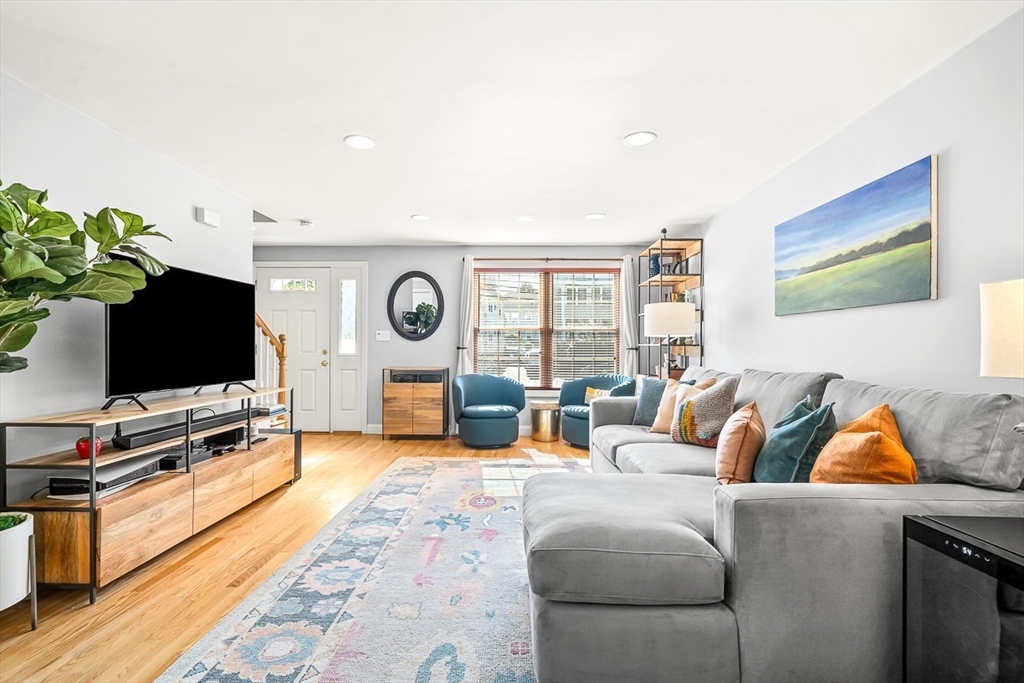 77 Warren Street, Unit A Arlington, MA 02474 - Photo 15 of 34 a living room with furniture and a flat screen tv