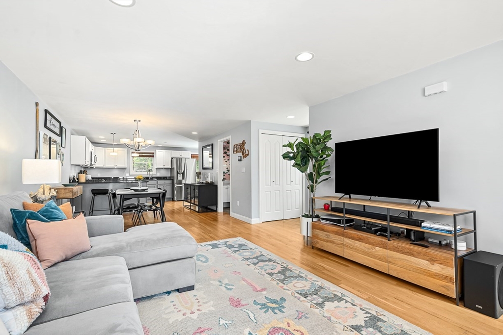 77 Warren Street, Unit A Arlington, MA 02474 - Photo 16 of 34 a living room with furniture and a flat screen tv