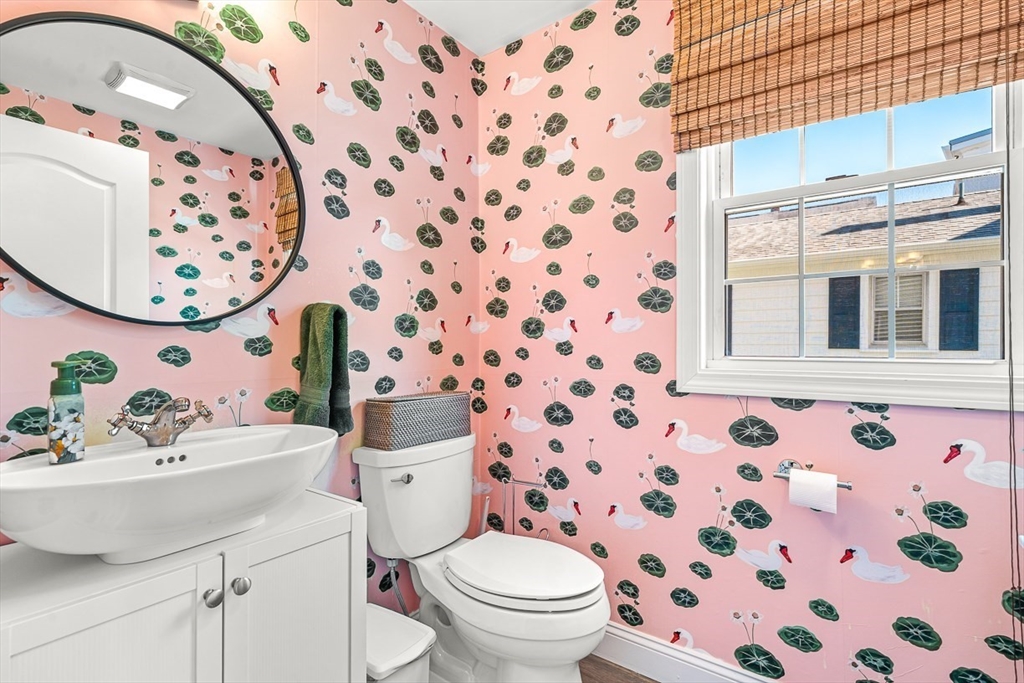 77 Warren Street, Unit A Arlington, MA 02474 - Photo 17 of 34 a bathroom with a sink and mirror with toilet