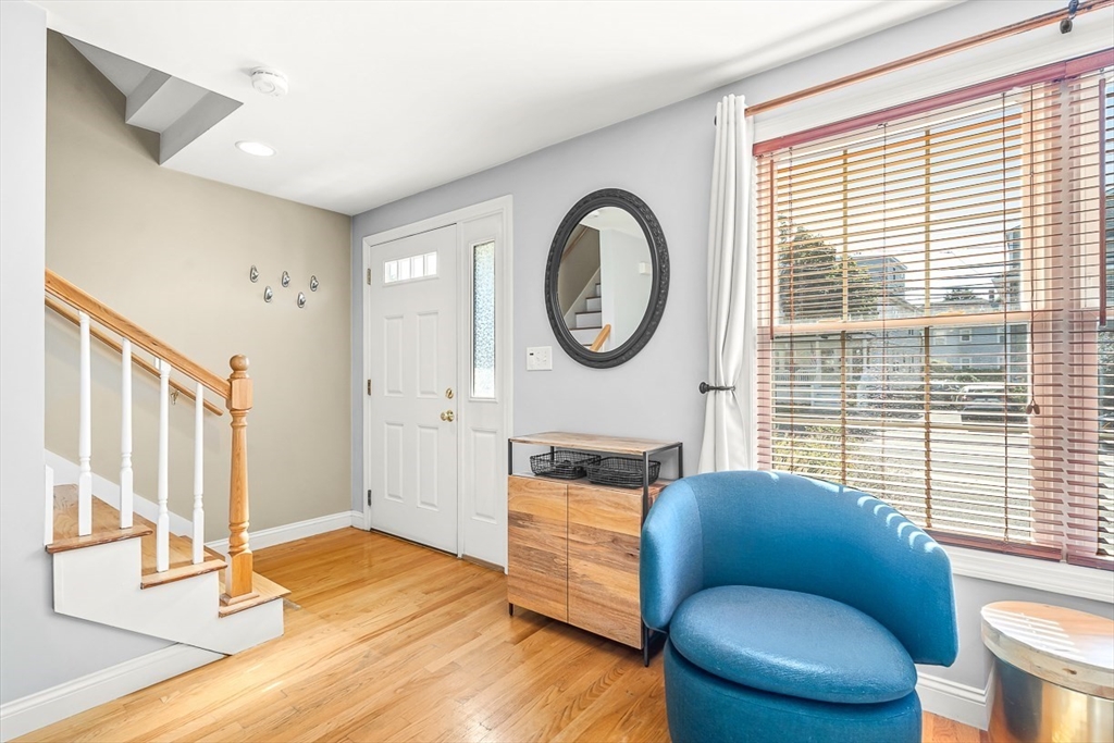 77 Warren Street, Unit A Arlington, MA 02474 - Photo 18 of 34 a living room with furniture and a large window