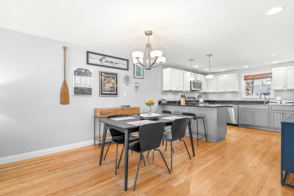 77 Warren Street, Unit A Arlington, MA 02474 - Photo 9 of 34 a view of a dining room with furniture window and wooden floor