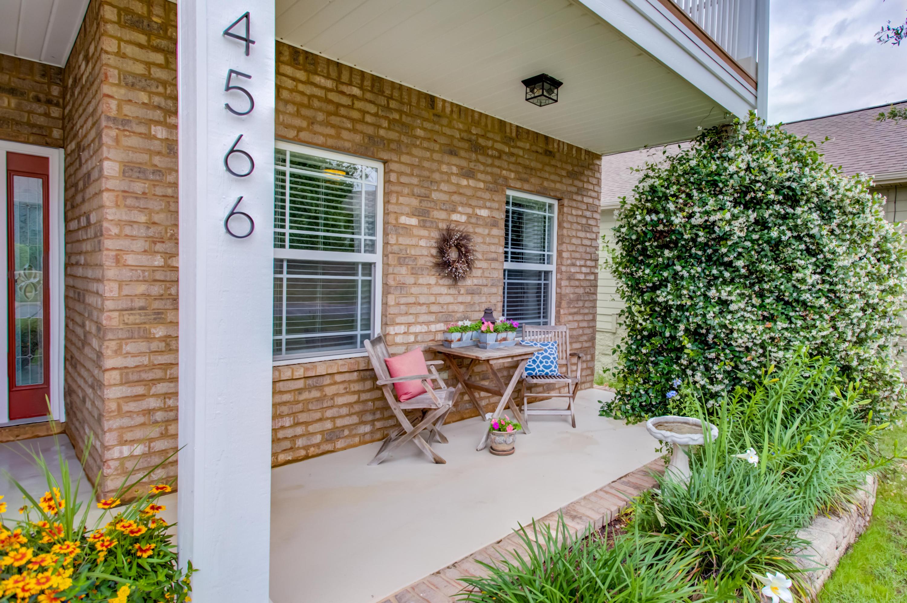 4566 Hermosa Road Crestview, FL 32539 - Photo 4 of 41 a roof deck with table and chairs and potted plants