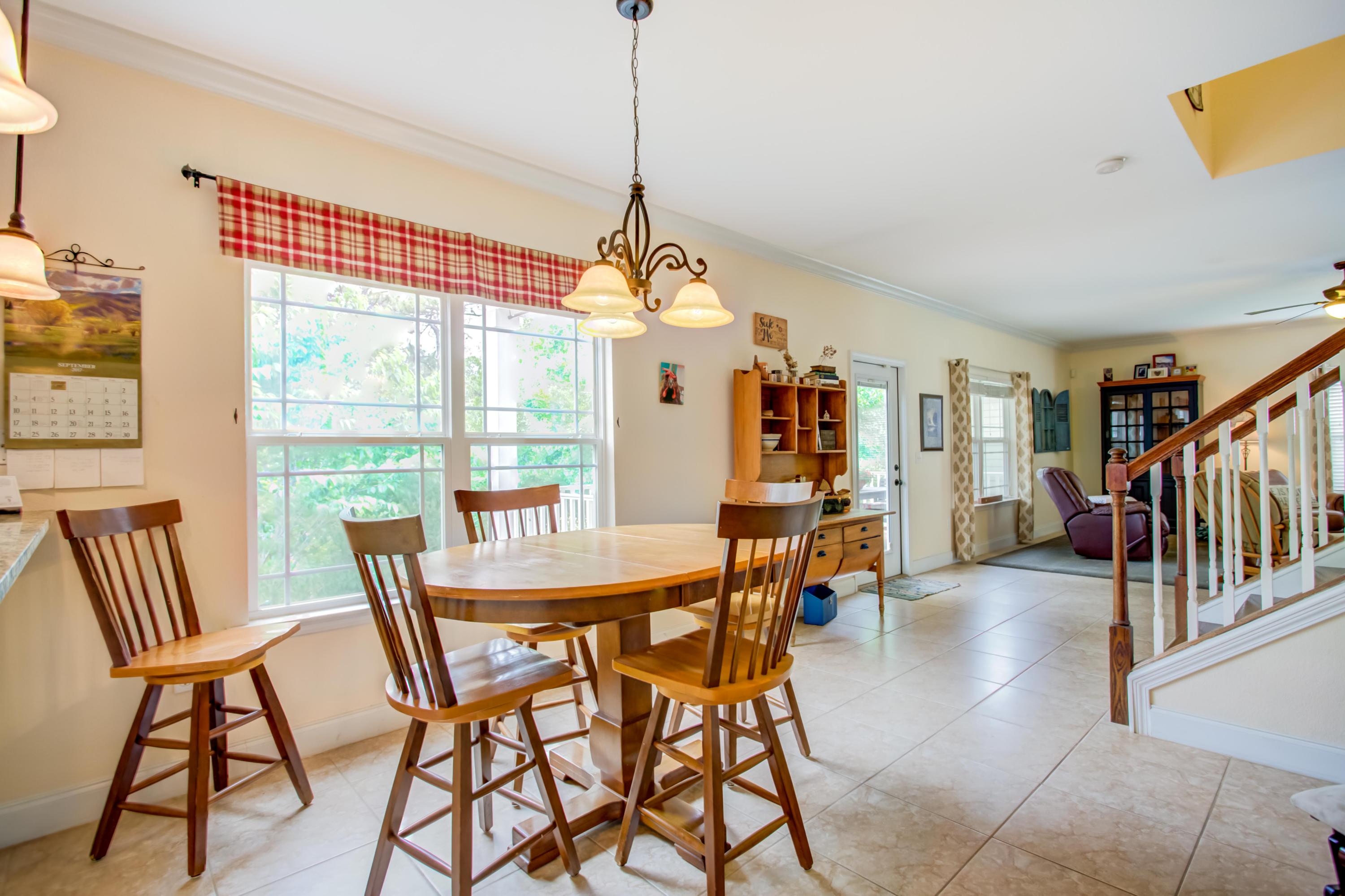 4566 Hermosa Road Crestview, FL 32539 - Photo 8 of 41 a dining room with furniture and window