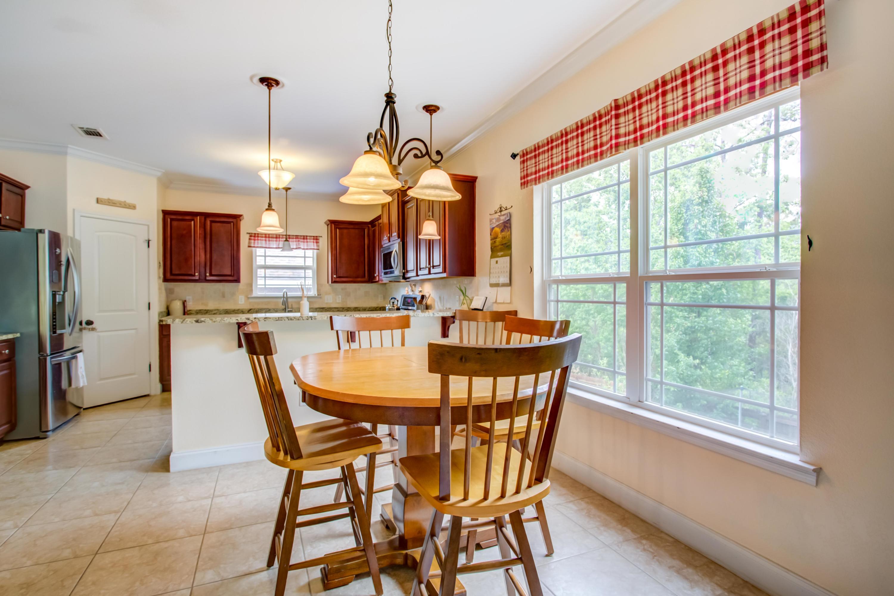 4566 Hermosa Road Crestview, FL 32539 - Photo 9 of 41 a view of a dining room with furniture window and outside view