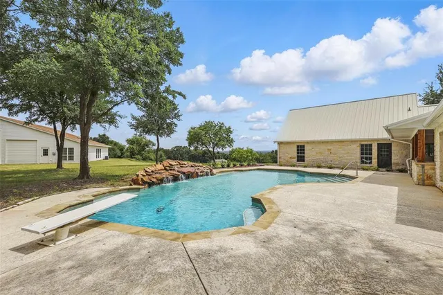 a picture of a bathroom with a white wall