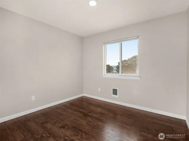 a room with window and wooden floor