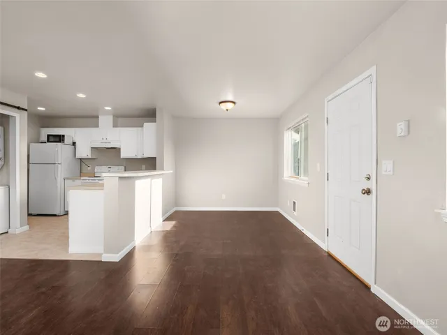 a view of kitchen with wooden floor