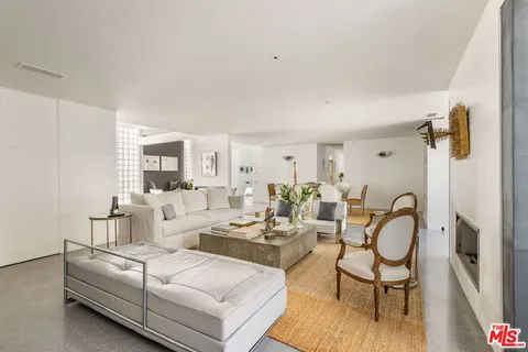 a view of living room with furniture and floor to ceiling window