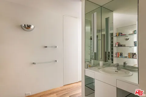 a bedroom with two beds and a window