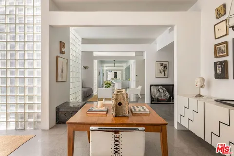 a dining room with a table and chairs