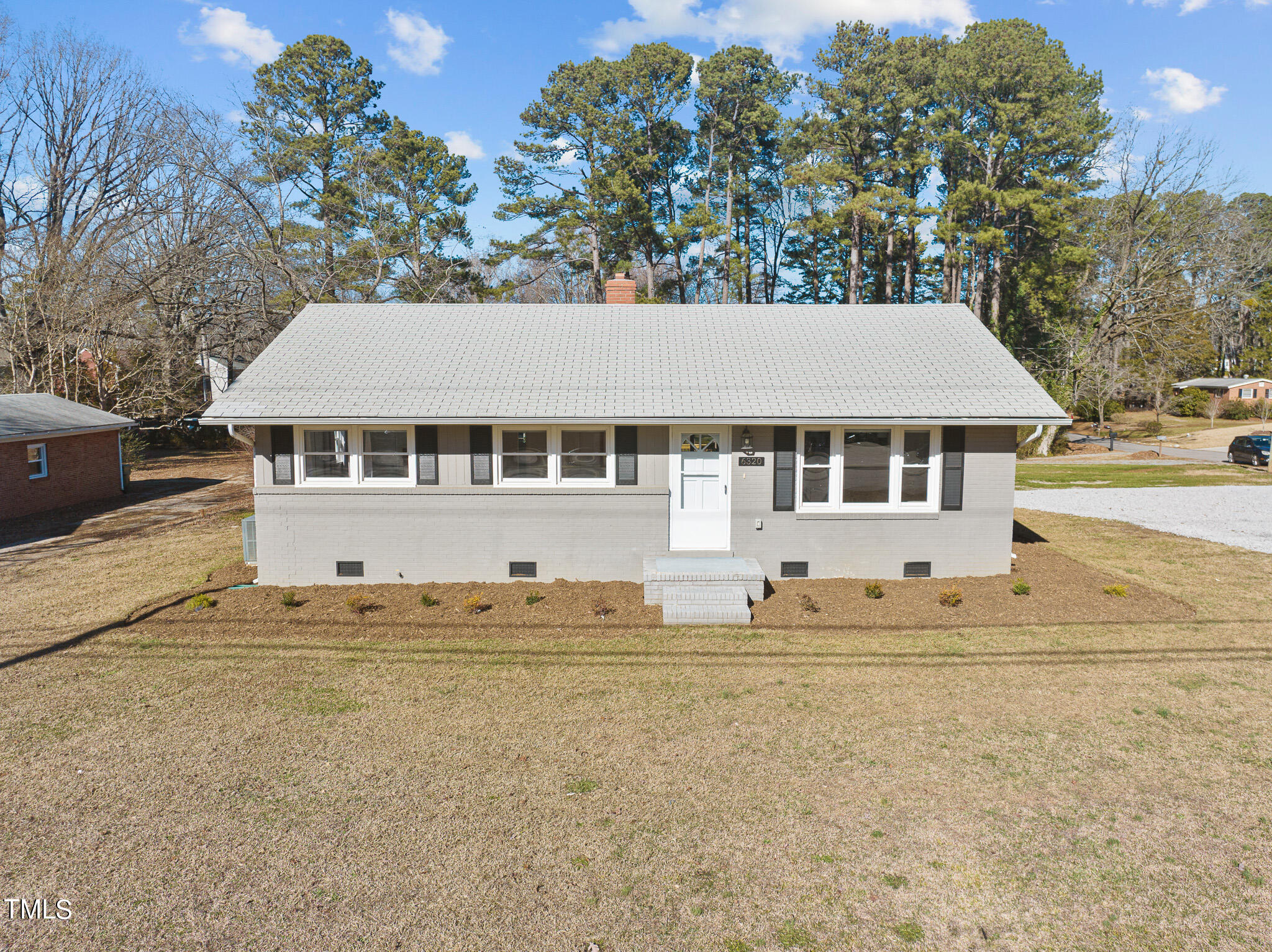 6320 Tryon Road Cary, NC 27518 - Photo 1 of 30 a house with trees in the background