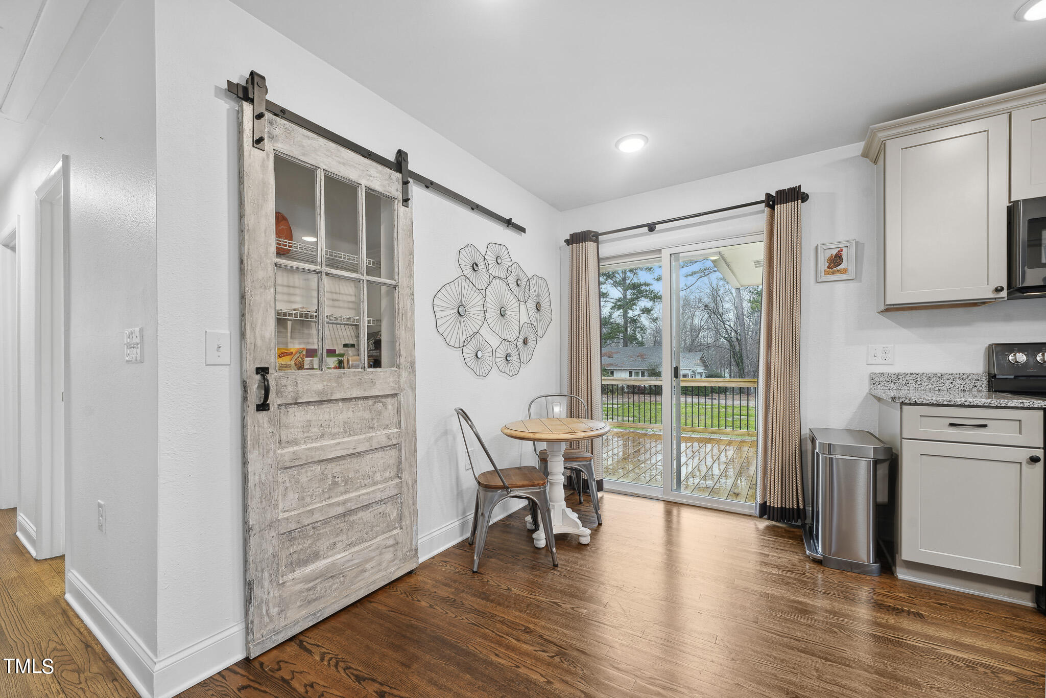 6320 Tryon Road Cary, NC 27518 - Photo 11 of 30 a view of a livingroom with furniture window and wooden floor