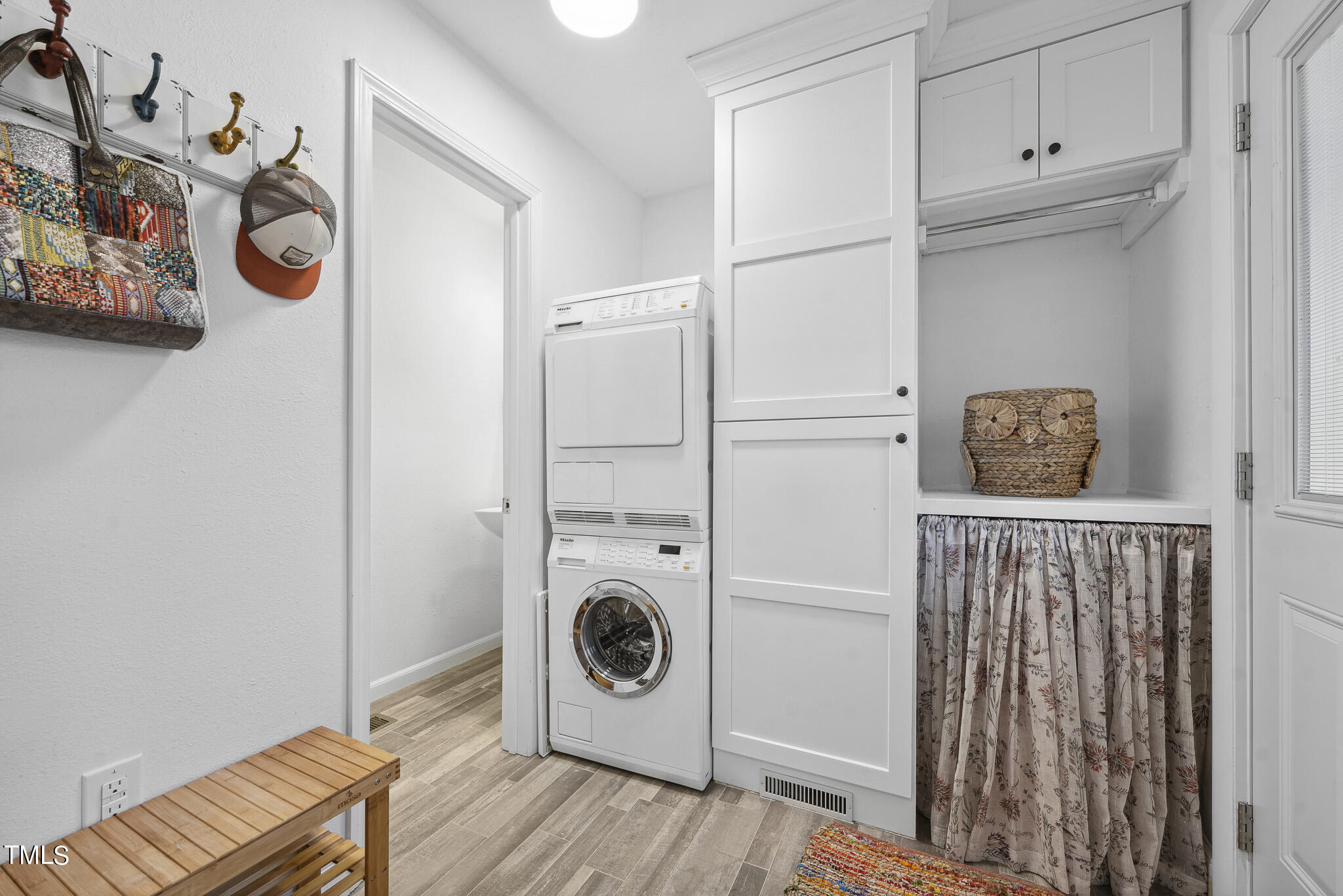 6320 Tryon Road Cary, NC 27518 - Photo 12 of 30 a view of a storage and utility room with washer and dryer