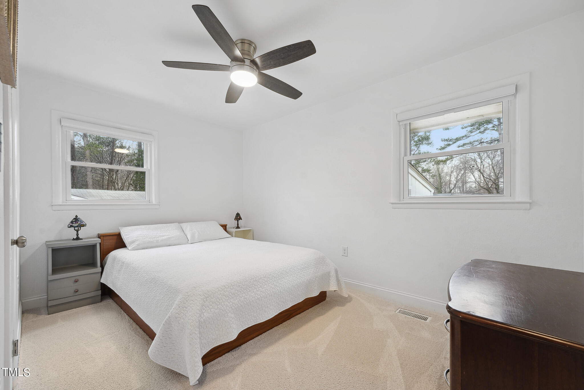 6320 Tryon Road Cary, NC 27518 - Photo 18 of 30 a bedroom with a bed and a desk