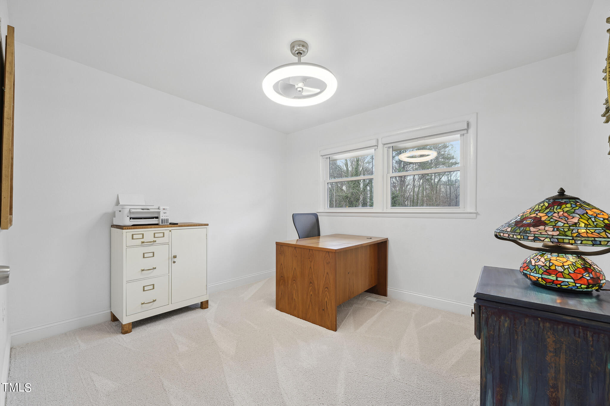 6320 Tryon Road Cary, NC 27518 - Photo 20 of 30 a bedroom with furniture and a window