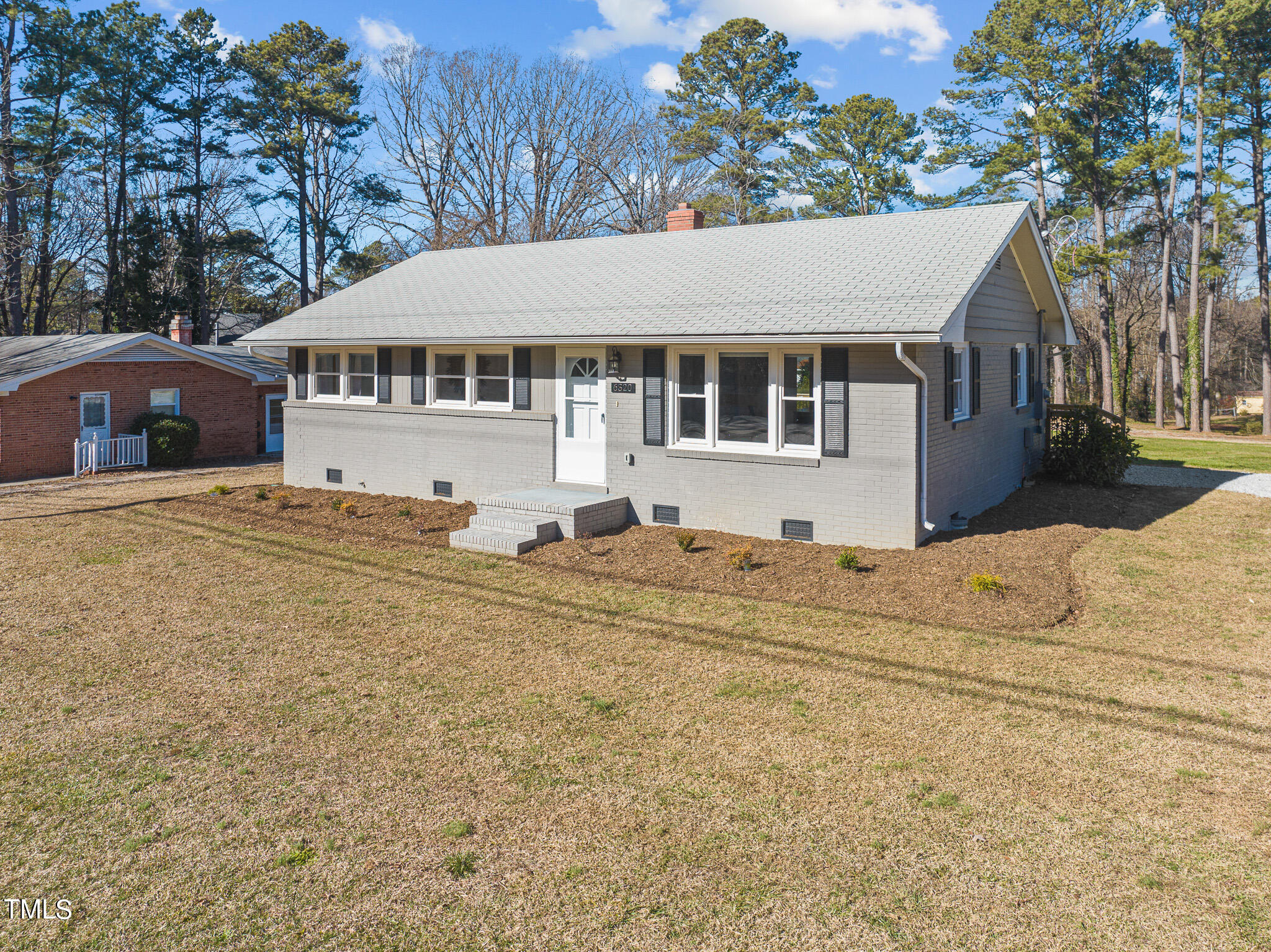 6320 Tryon Road Cary, NC 27518 - Photo 2 of 30 a house with trees in the background