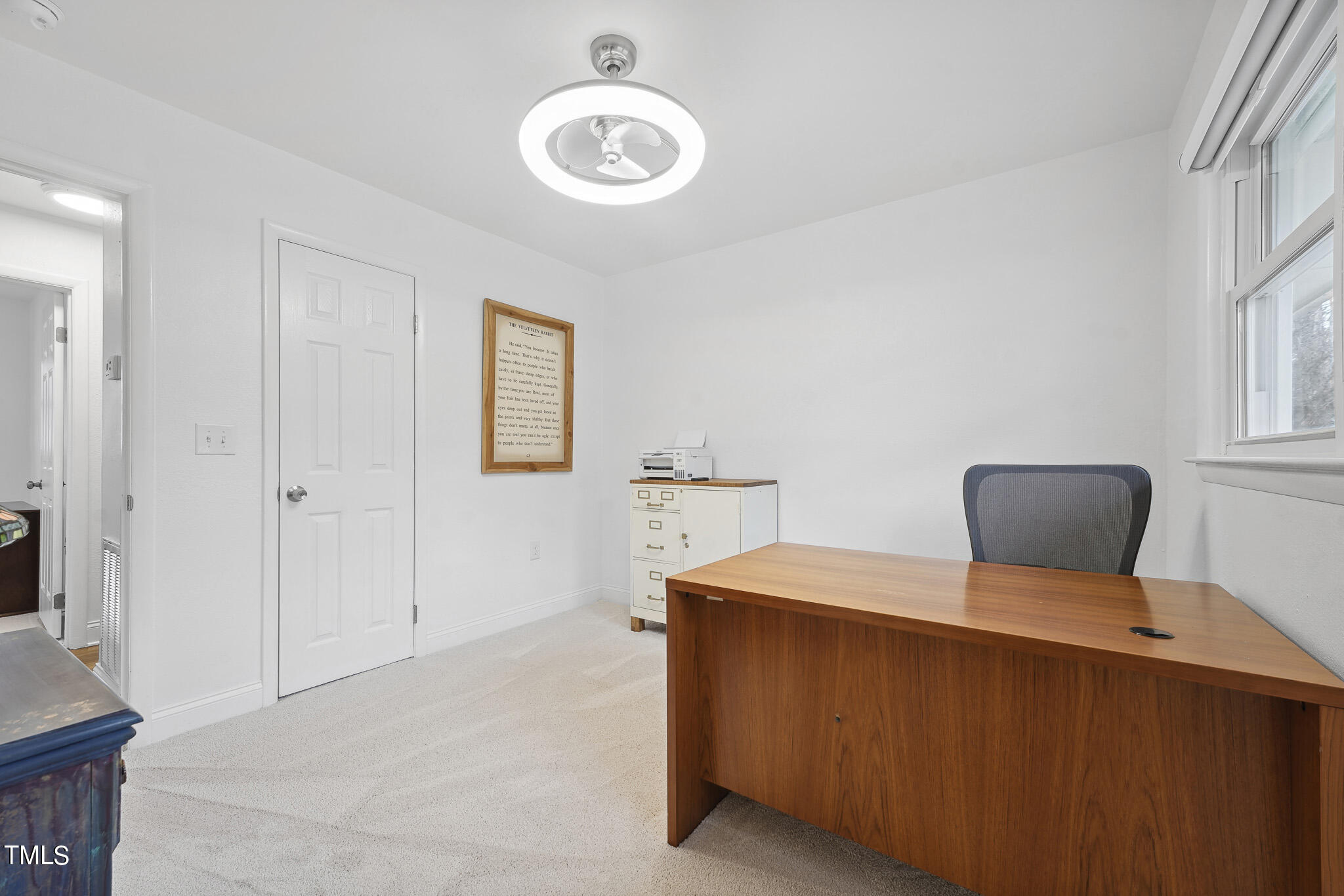 6320 Tryon Road Cary, NC 27518 - Photo 21 of 30 a bedroom with a bed and chandelier