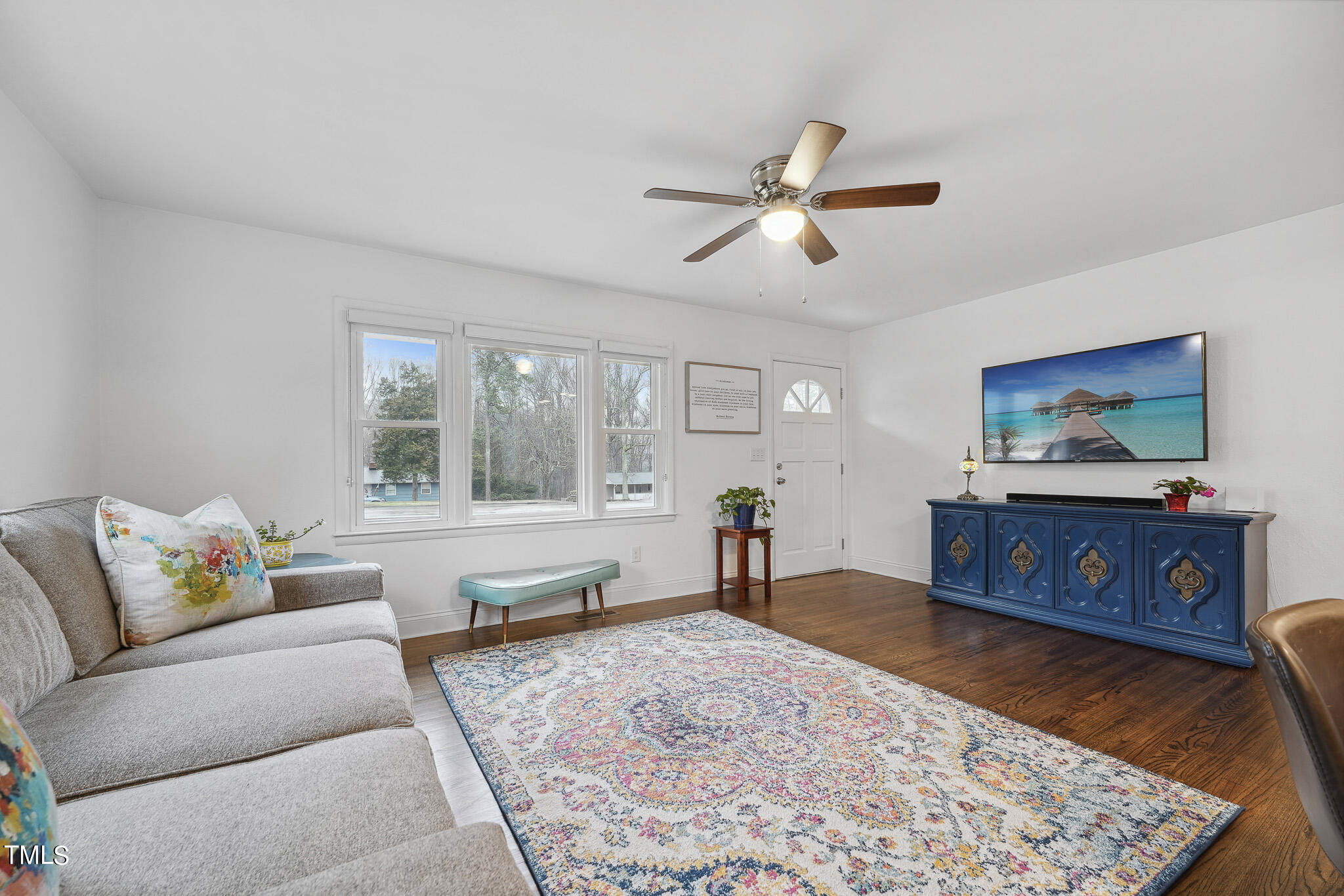 6320 Tryon Road Cary, NC 27518 - Photo 3 of 30 a living room with furniture and a flat screen tv
