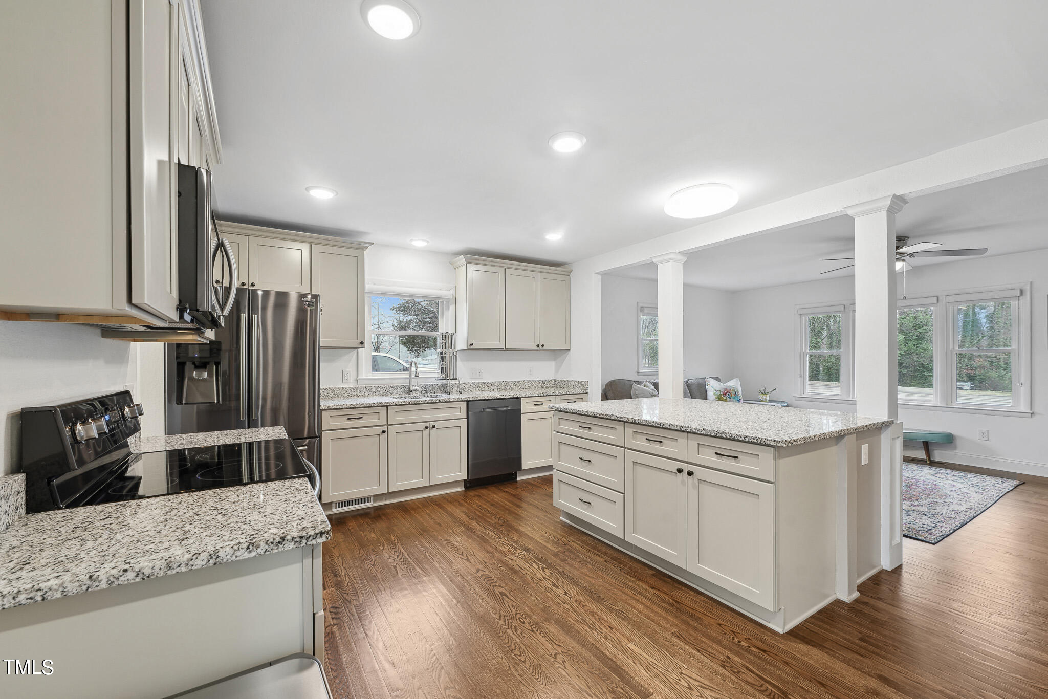 6320 Tryon Road Cary, NC 27518 - Photo 8 of 30 a kitchen with stainless steel appliances granite countertop a stove oven and refrigerator
