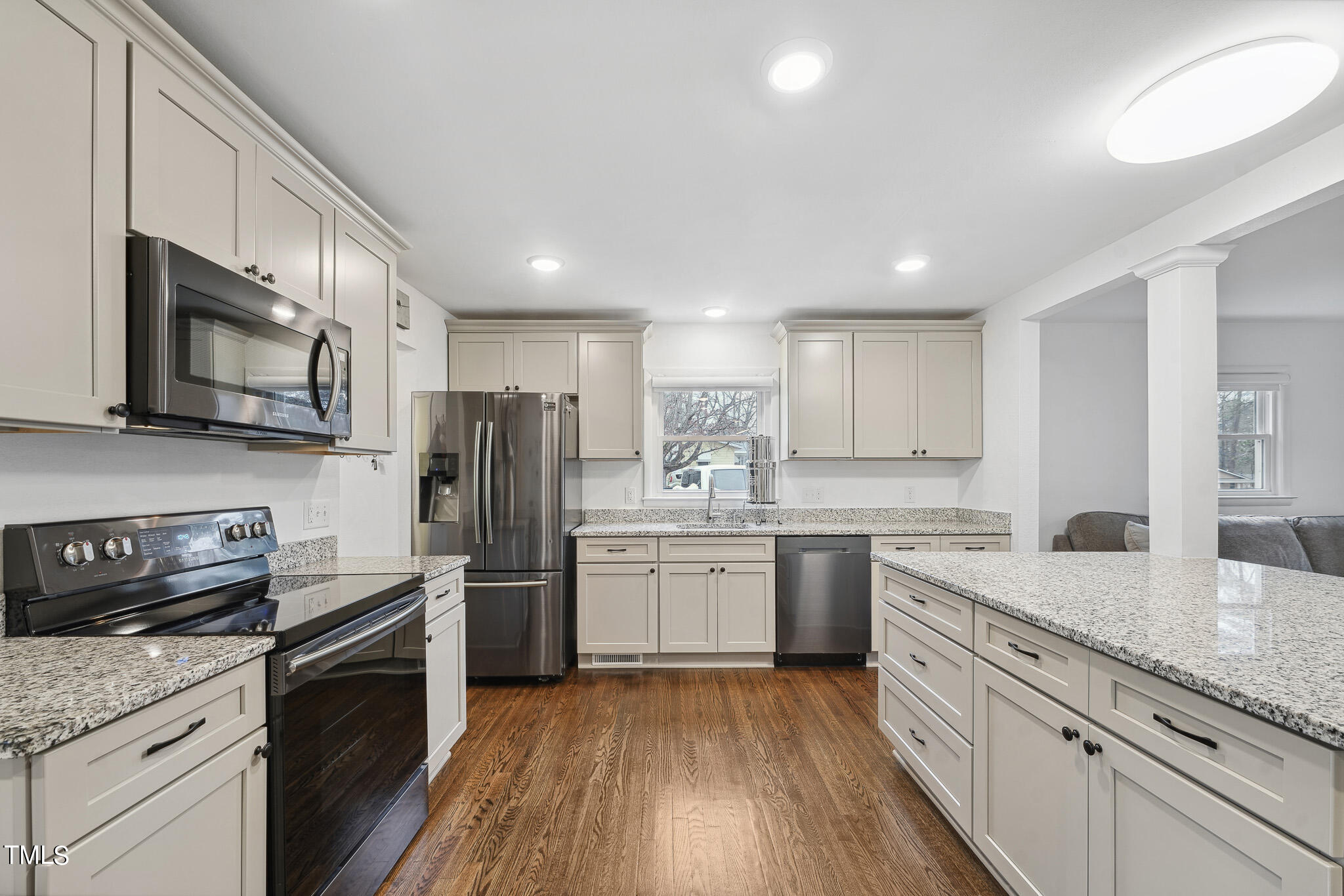 6320 Tryon Road Cary, NC 27518 - Photo 9 of 30 a kitchen with granite countertop stainless steel appliances and wooden cabinets