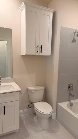 a bathroom with a sink and mirror