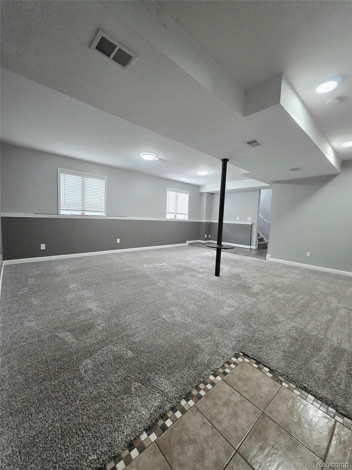5158 Coldwater Road Columbiaville, MI 48421 - Photo 3 of 25 Spacious finished basement featuring recessed lighting, a neutral gray color palette, and light gray carpeting
