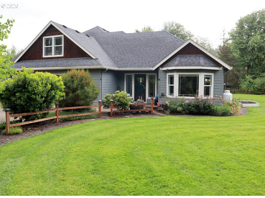 29778 Gimpl Hill Road Eugene, OR 97405 - Photo 1 of 43 a front view of a house with garden