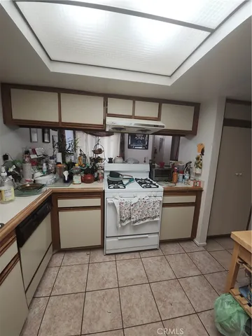 a bedroom with a bed lamp and window