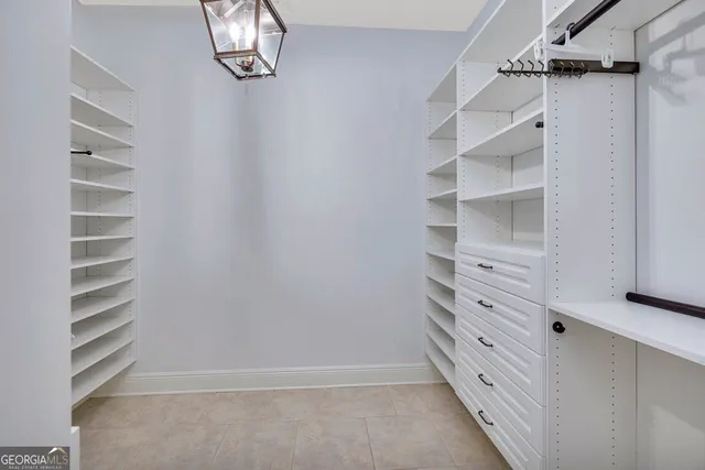 an empty room with wooden floor and a window