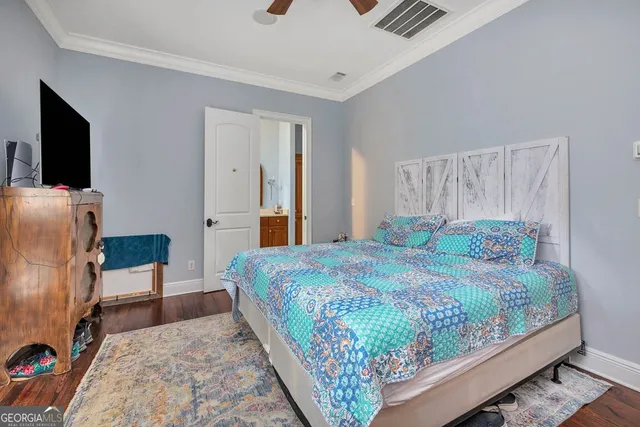 a bathroom with a sink toilet double vanity and shower