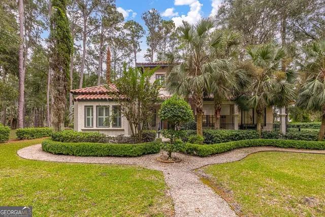 a view of pool and garden