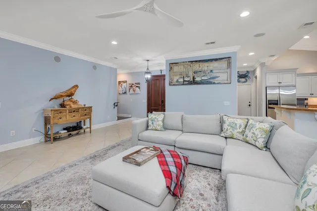 a bedroom with furniture and a large window