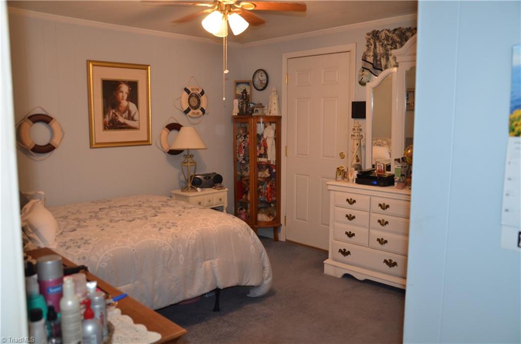 1631 Sexton Road Denton, NC 27239 - Photo 11 of 15 Spacious Bedroom with Ceiling fan, & Crown Molding