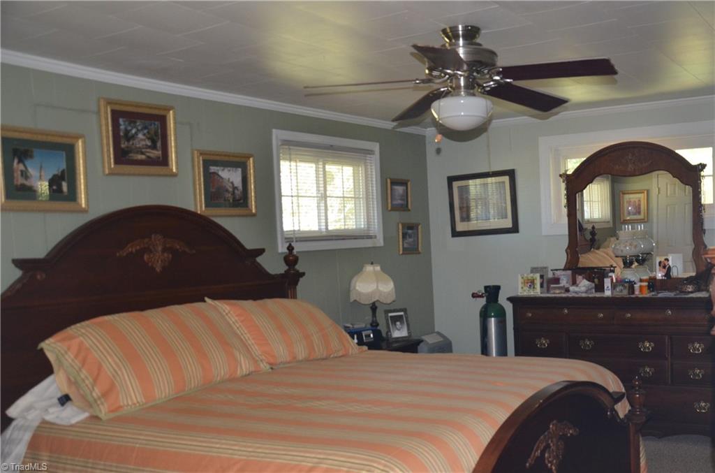 1631 Sexton Road Denton, NC 27239 - Photo 5 of 15 Large Master Bedroom with Crown Molding and Ceiling Fan