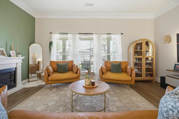 a living room with furniture and a fireplace