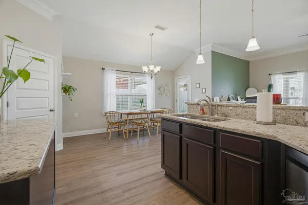 a kitchen with center island table and chairs in it