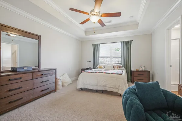 a bed room with a bed and a dresser