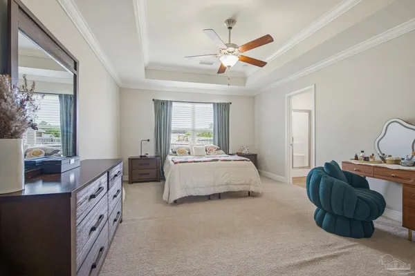 a spacious bedroom with a bed and window
