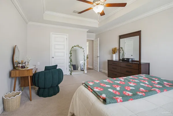 a bedroom with furniture and a chandelier
