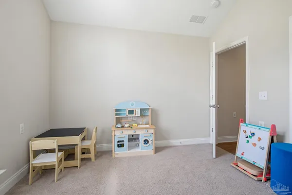 a view of a livingroom with furniture and a window