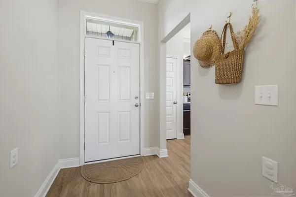 a view of a livingroom with wooden floor and closet