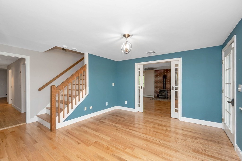 149 Pleasant Valley Road Amesbury, MA 01913 - Photo 18 of 42 a view of a hallway with wooden floor and entryway