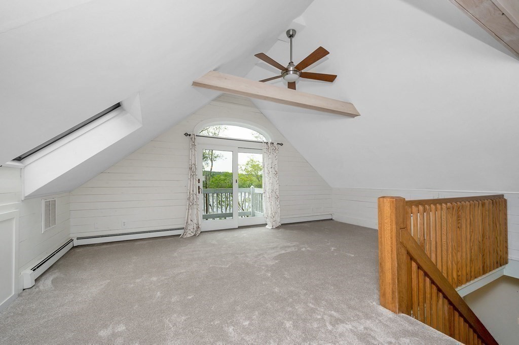 149 Pleasant Valley Road Amesbury, MA 01913 - Photo 20 of 42 an empty room with a ceiling fan and window